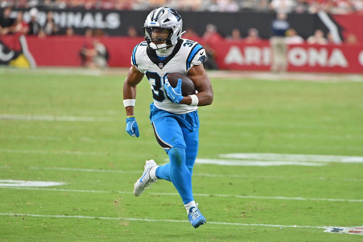 Sep 14, 2025; Glendale, Arizona, USA;  Carolina Panthers running back Chuba Hubbard (30) runs with the ball during the fourth quarter against the Arizona Cardinals at State Farm Stadium. Mandatory Credit: Matt Kartozian-Imagn Images