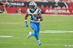 Sep 14, 2025; Glendale, Arizona, USA;  Carolina Panthers running back Chuba Hubbard (30) runs with the ball during the fourth quarter against the Arizona Cardinals at State Farm Stadium. Mandatory Credit: Matt Kartozian-Imagn Images