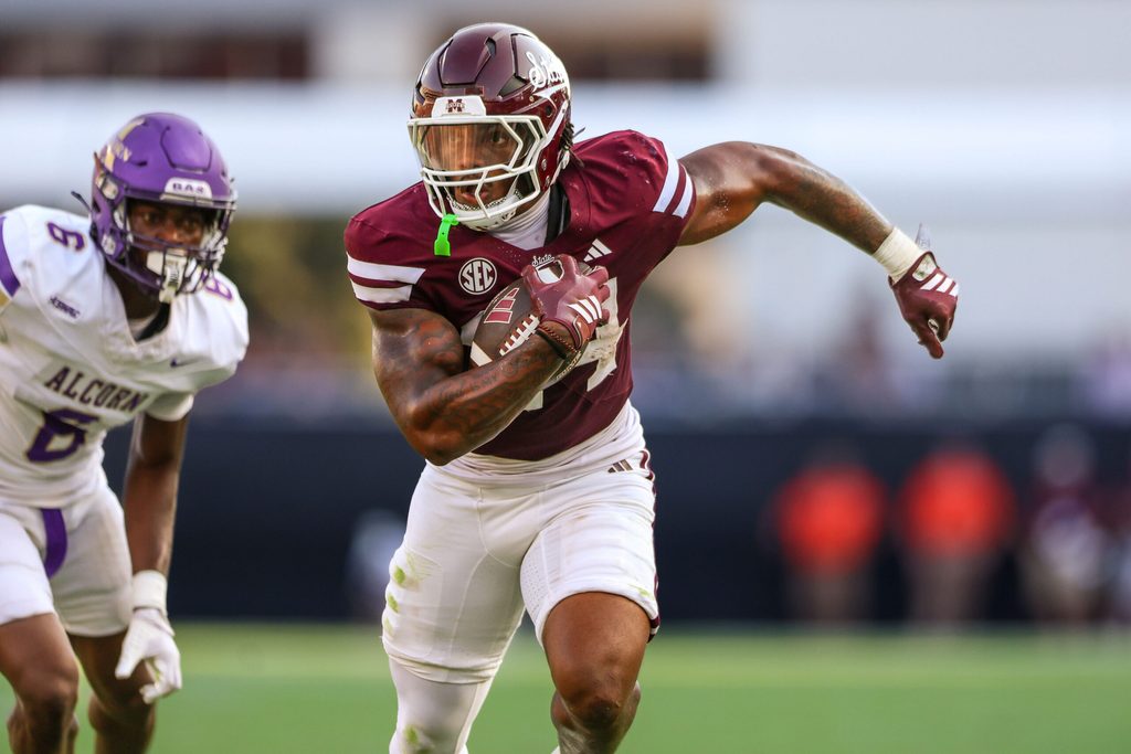 Sep 13, 2025; Starkville, Mississippi, USA; Mississippi State Bulldogs running back Fluff Bothwell (24) runs with the ball against the Alcorn State Braves during the second quarter at Davis Wade Stadium at Scott Field. Mandatory Credit: Wesley Hale-Imagn Images