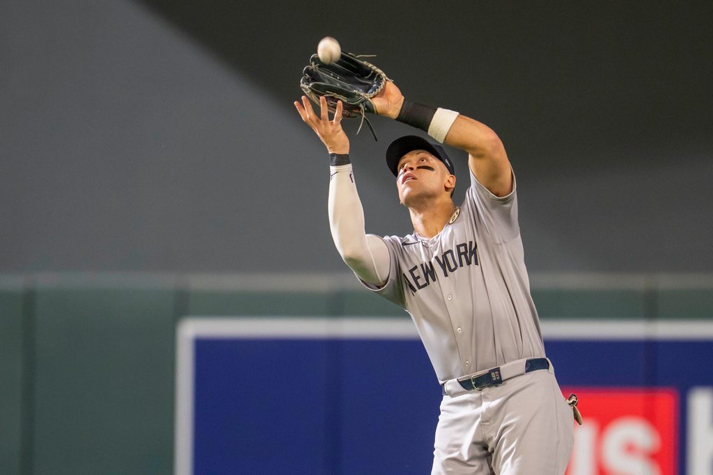 Sep 15, 2025; Minneapolis, Minnesota, USA; New York Yankees right fielder Aaron Judge (99) catches a fly ball against the Minnesota Twins in the fifth inning at Target Field. Mandatory Credit: Jesse Johnson-Imagn Images