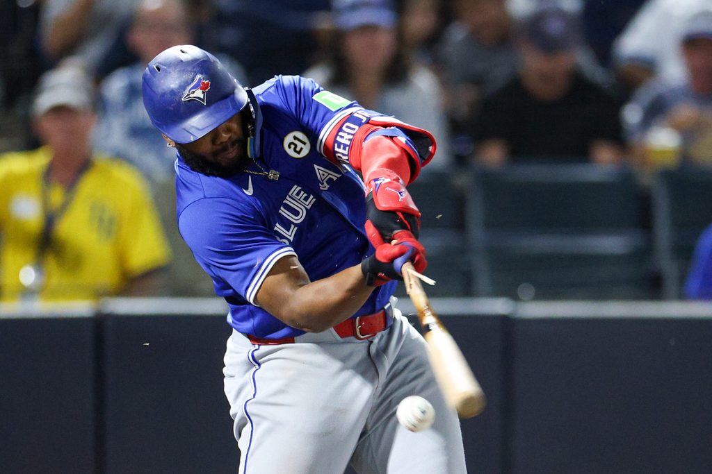 Sep 15, 2025; Tampa, Florida, USA; Toronto Blue Jays first base Vladimir Guerrero Jr. (21) breaks his bat on a ground ball against the Tampa Bay Rays in the sixth inning at George M. Steinbrenner Field. Mandatory Credit: Nathan Ray Seebeck-Imagn Images