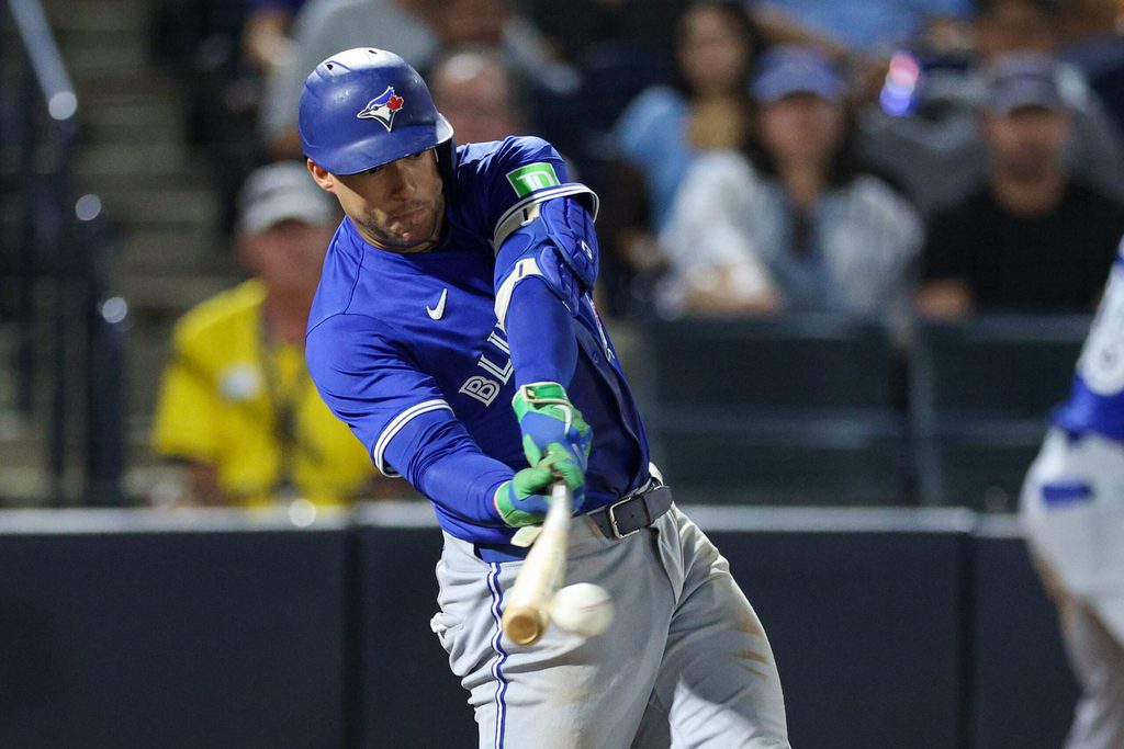 Sep 15, 2025; Tampa, Florida, USA; Toronto Blue Jays outfielder George Springer (21) hits an rbi single against the Tampa Bay Rays in the eleventh inning at George M. Steinbrenner Field. Mandatory Credit: Nathan Ray Seebeck-Imagn Images