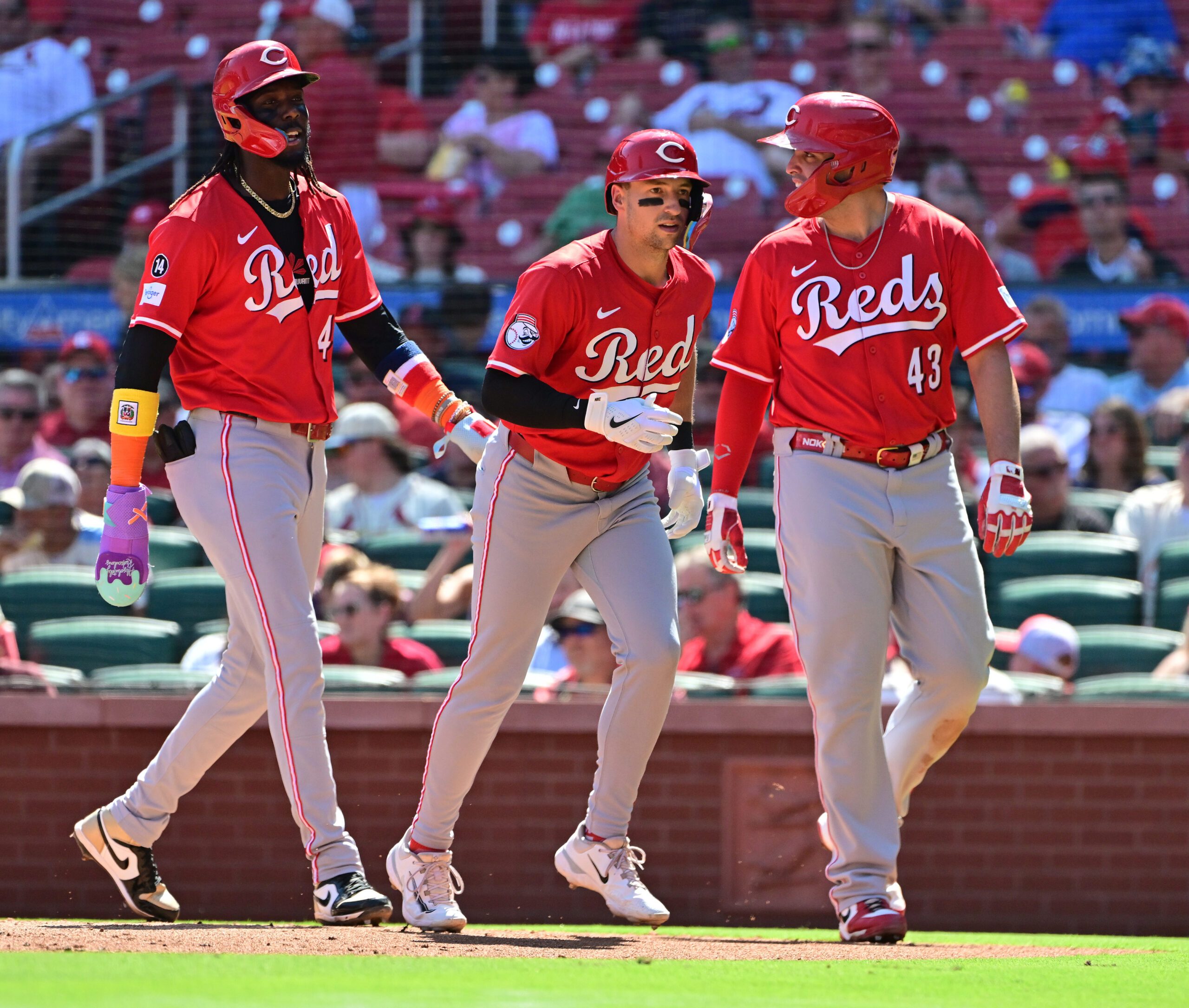 Sep 17, 2025; St. Louis, Missouri, USA; Cincinnati Reds shortstop Elly De La Cruz (44, left), Cincinnati Reds first baseman Spencer Steer (7, center), and Cincinnati Reds third baseman Sal Stewart (43) walk back to the dugout after Steer hit a three-rin home run in the fourth inning against the St. Louis Cardinals at Busch Stadium. Mandatory Credit: Tim Vizer-Imagn Images