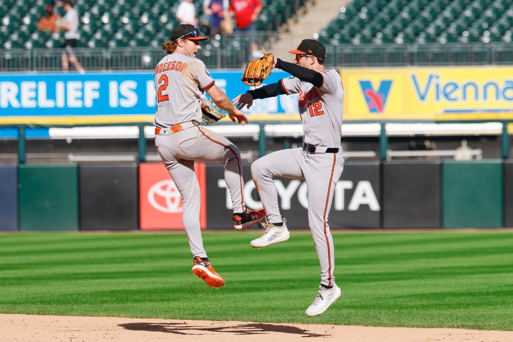 Sep 17, 2025; Chicago, Illinois, USA; Baltimore Orioles shortstop Gunnar Henderson (2) and left fielder Dylan Beavers (12) celebrate team's win against the Chicago White Sox in a baseball game at Rate Field. Mandatory Credit: Kamil Krzaczynski-Imagn Images