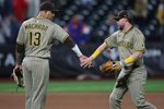 Sep 17, 2025; New York City, New York, USA; San Diego Padres second baseman Jake Cronenworth (9) celebrates with third baseman Manny Machado (13) after the game against the New York Mets at Citi Field. Mandatory Credit: Vincent Carchietta-Imagn Images