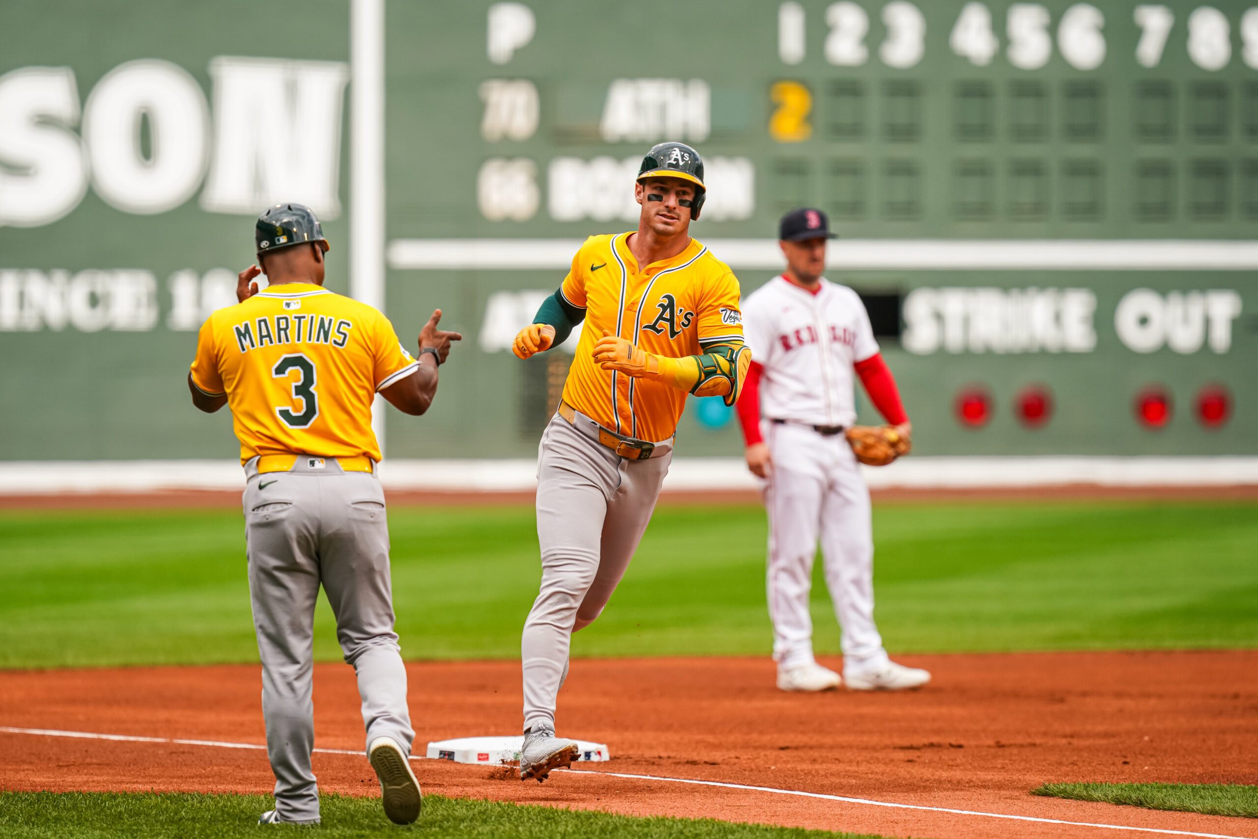 Sep 18, 2025; Boston, Massachusetts, USA; Athletics designated hitter Brent Rooker (25) rounds third base after hitting a two run home run against the Boston Red Sox in the first inning at Fenway Park. Mandatory Credit: David Butler II-Imagn Images