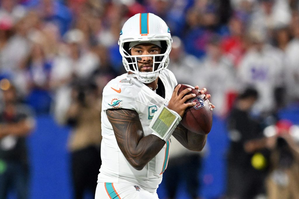 Sep 18, 2025; Orchard Park, New York, USA; Miami Dolphins quarterback Tua Tagovailoa (1) looks to pass in the first half against the Buffalo Bills at Highmark Stadium. Mandatory Credit: Mark Konezny-Imagn Images