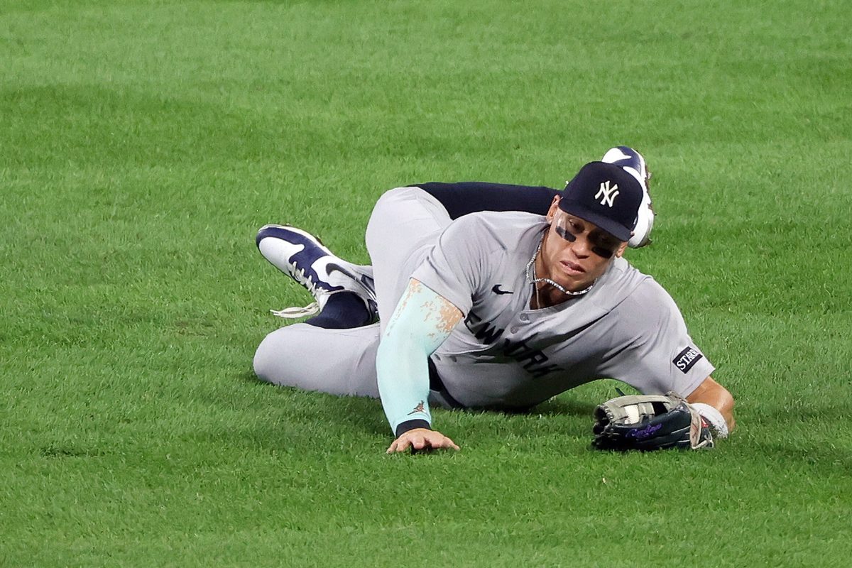 Sep 19, 2025; Baltimore, Maryland, USA; New York Yankees outfielder Aaron Judge (99) makes a diving catch during the third inning against the Baltimore Orioles at Oriole Park at Camden Yards. Mandatory Credit: Daniel Kucin Jr.-Imagn Images