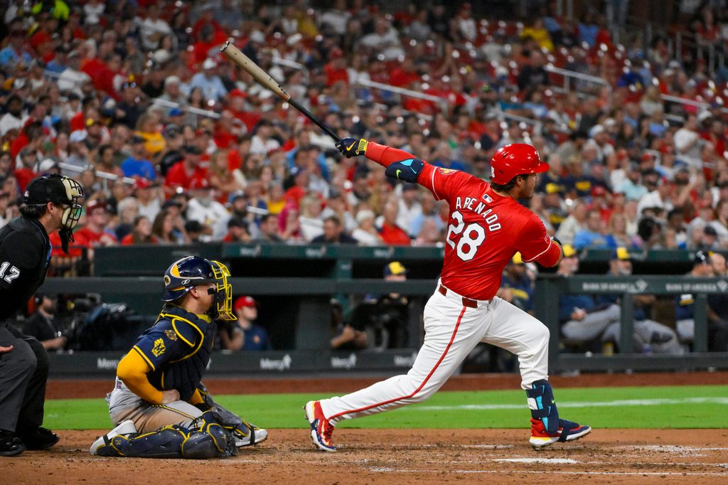 Sep 19, 2025; St. Louis, Missouri, USA; St. Louis Cardinals third baseman Nolan Arenado (28) hits a three run double against the Milwaukee Brewers during the fifth inning at Busch Stadium. Mandatory Credit: Jeff Curry-Imagn Images