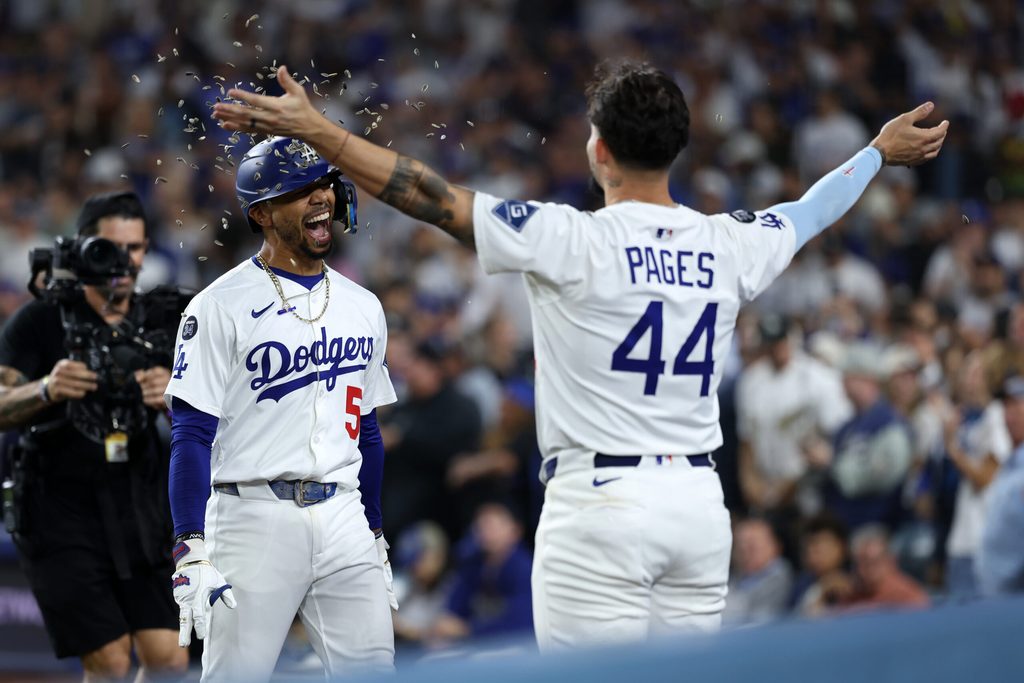 Sep 19, 2025; Los Angeles, California, USA; Los Angeles Dodgers shortstop Mookie Betts (left) celebrates with center fielder Andy Pages (44) after hitting a solo home run during the fifth inning against the San Francisco Giants at Dodger Stadium. Mandatory Credit: Kiyoshi Mio-Imagn Images