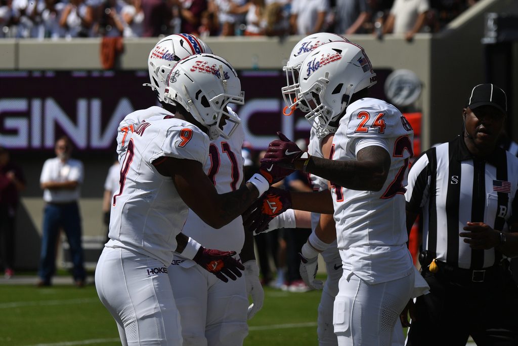 Sep 20, 2025; Blacksburg, Virginia, USA; Virginia Tech Hokies wide receiver Cameron Seldon (9) celebrates with running back Braydon Bennett (24) after a touchdown run during the first quarter against the Wofford Terriers at Lane Stadium. Mandatory Credit: Brian Bishop-Imagn Images