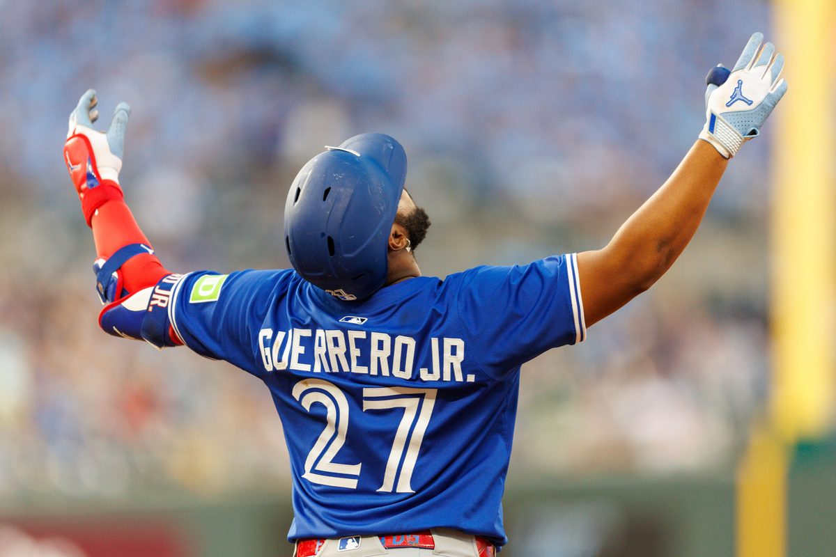 Sep 20, 2025; Kansas City, Missouri, USA; Toronto Blue Jays first base Vladimir Guerrero Jr. (27) reacts to a play during the fourth inning against the Kansas City Royals at Kauffman Stadium. Mandatory Credit: William Purnell-Imagn Images