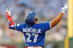 Sep 20, 2025; Kansas City, Missouri, USA; Toronto Blue Jays first base Vladimir Guerrero Jr. (27) reacts to a play during the fourth inning against the Kansas City Royals at Kauffman Stadium. Mandatory Credit: William Purnell-Imagn Images