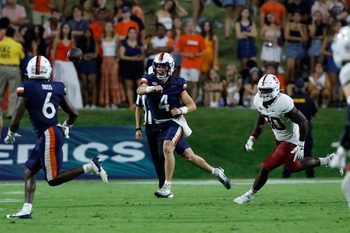 Sep 20, 2025; Charlottesville, Virginia, USA; Virginia Cavaliers quarterback Chandler Morris (4) passes the ball to Cavaliers wide receiver Cam Ross (6) as Stanford Cardinal linebacker Ese Dubre (30) chases during the second quarter at Scott Stadium. Mandatory Credit: Geoff Burke-Imagn Images