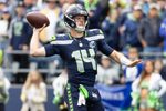 Sep 21, 2025; Seattle, Washington, USA; Seattle Seahawks quarterback Sam Darnold (14) throws the ball during the first quarter against New Orleans Saints at Lumen Field. Mandatory Credit: Joe Nicholson-Imagn Images
