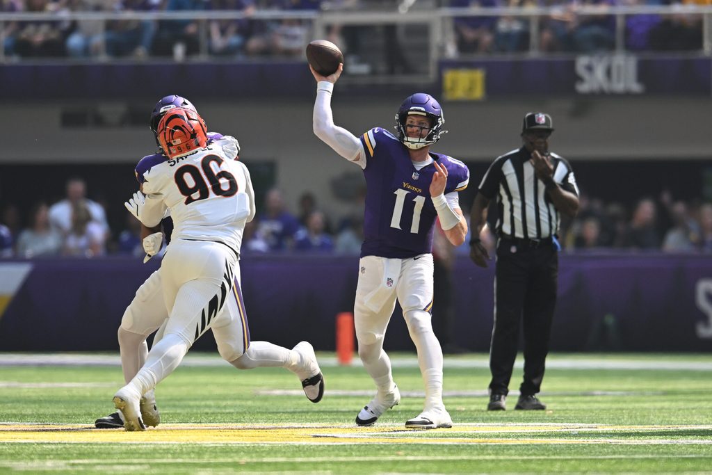 Sep 21, 2025; Minneapolis, Minnesota, USA; Minnesota Vikings quarterback Carson Wentz (11) throws downfield Cincinnati Bengals during the second half at U.S. Bank Stadium. Mandatory Credit: Jeffrey Becker-Imagn Images