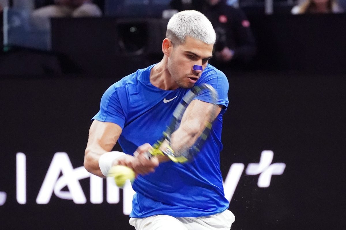 Sep 21, 2025; San Francisco, CA, USA;  Team Europe player Carlos Alcaraz returns a shot from Team World player Francisco Cerundolo during the Laver Cup at Chase Center. Mandatory Credit: David Gonzales-Imagn Images
