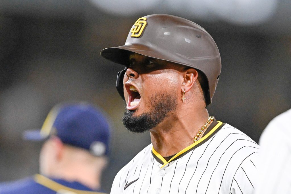 Sep 22, 2025; San Diego, California, USA; San Diego Padres first baseman Luis Arraez (4) celebrates after hitting an RBI single during the seventh inning against the Milwaukee Brewers at Petco Park. Mandatory Credit: Denis Poroy-Imagn Images