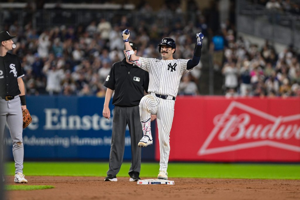 Sep 23, 2025; Bronx, New York, USA; New York Yankees catcher Austin Wells (28) reacts after hitting a RBI double against the Chicago White Sox during the second inning at Yankee Stadium. Mandatory Credit: John Jones-Imagn Images
