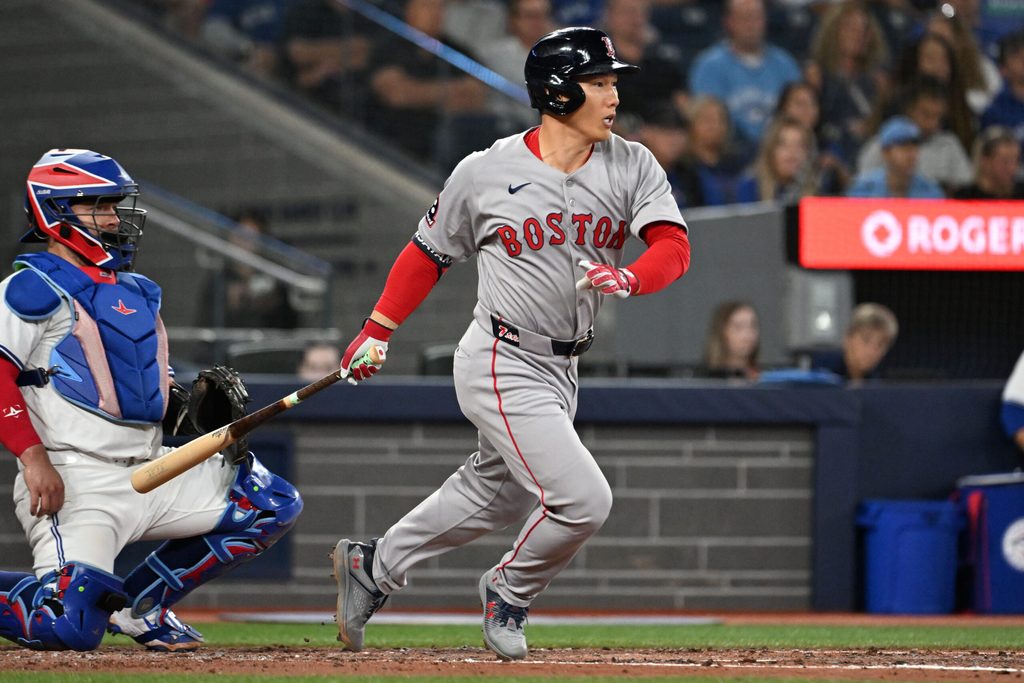 Sep 23, 2025; Toronto, Ontario, CAN; Boston Red Sox designated hitter Masataka Yoshida (7) hits a single against the Toronto Blue Jays in the fourth inning at Rogers Centre. Mandatory Credit: Dan Hamilton-Imagn Images