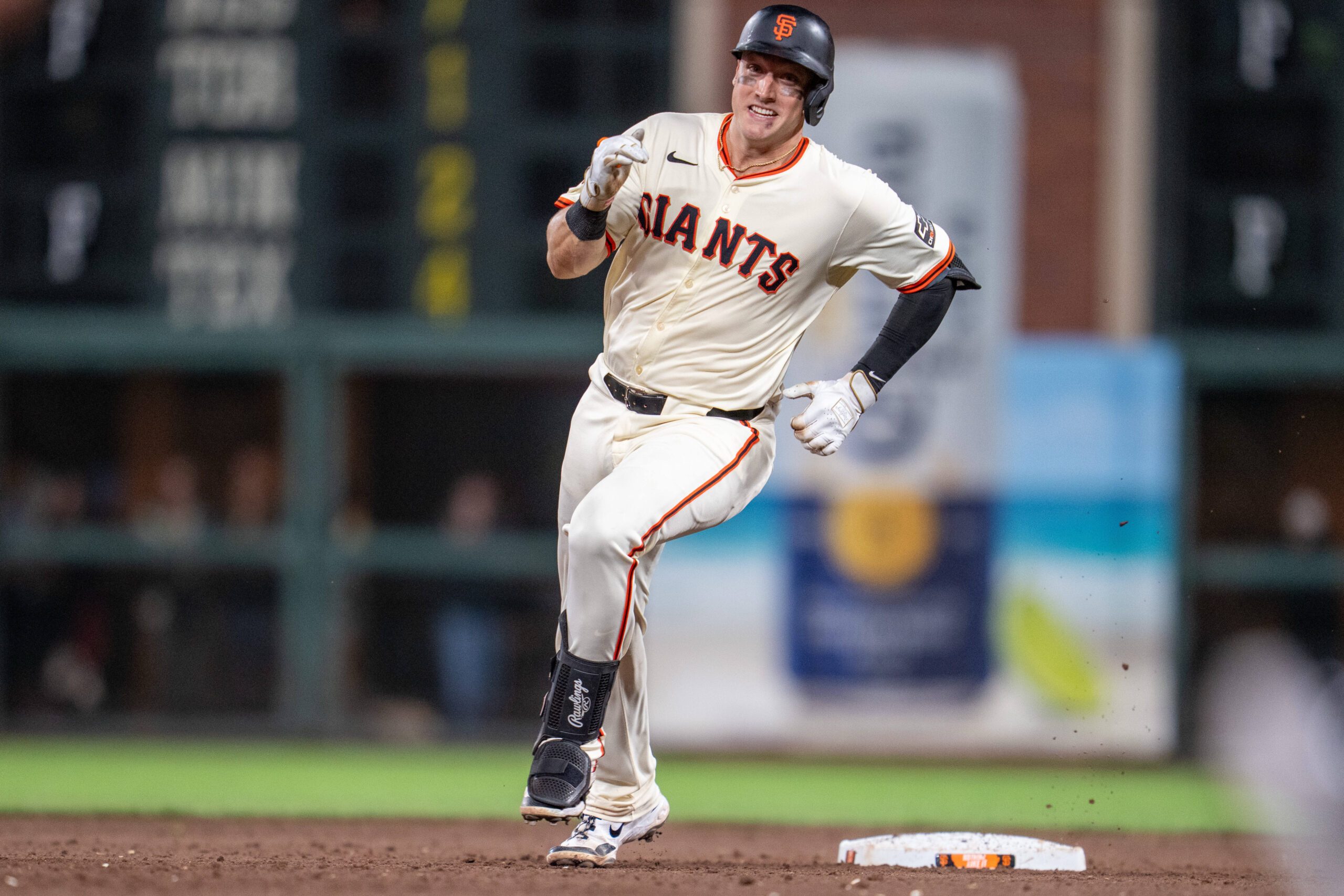 Sep 24, 2025; San Francisco, California, USA; San Francisco Giants catcher Andrew Knizner (21) rounds second base on his triple against the St. Louis Cardinals during the eighth inning at Oracle Park. Mandatory Credit: Neville E. Guard-Imagn Images