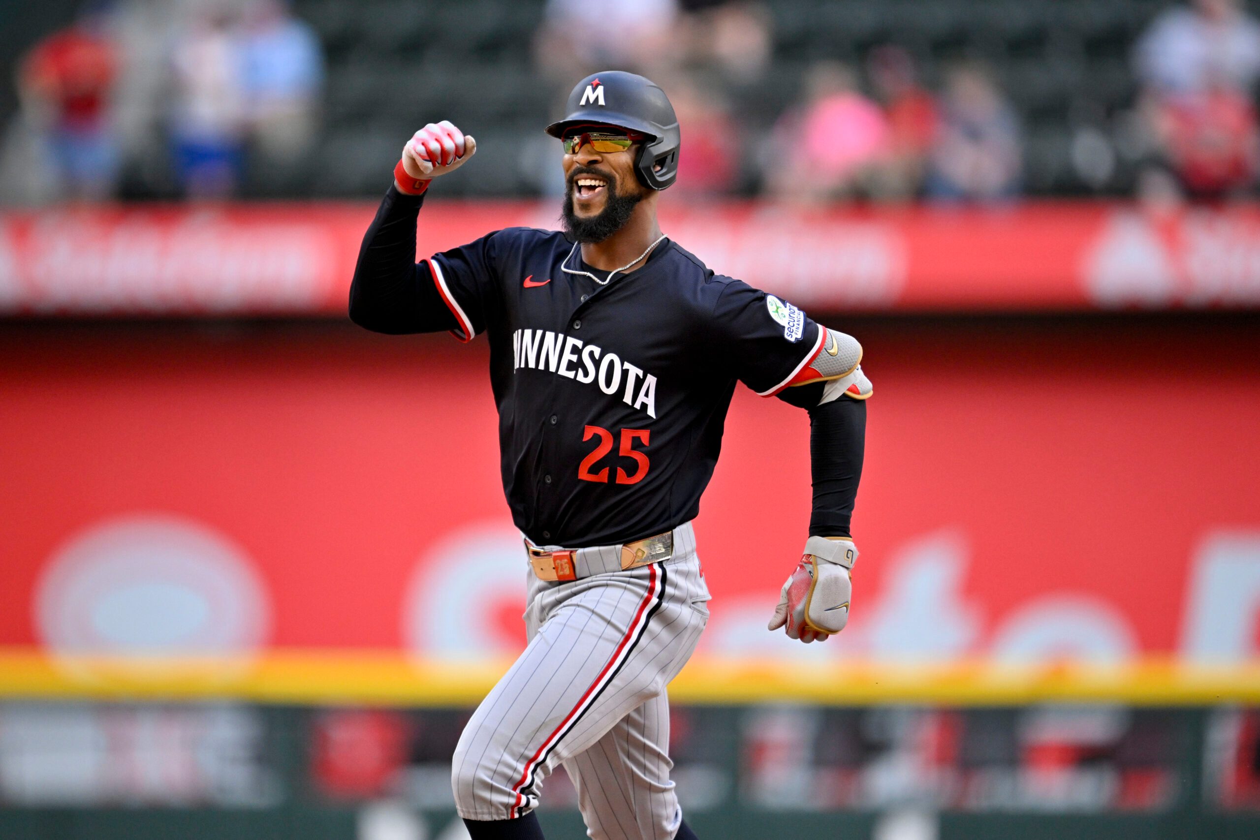 Sep 25, 2025; Arlington, Texas, USA; Minnesota Twins center fielder Byron Buxton (25) celebrates as he rounds the bases after hitting a three run home run against the Texas Rangers during the eighth inning at Globe Life Field. Mandatory Credit: Jerome Miron-Imagn Images