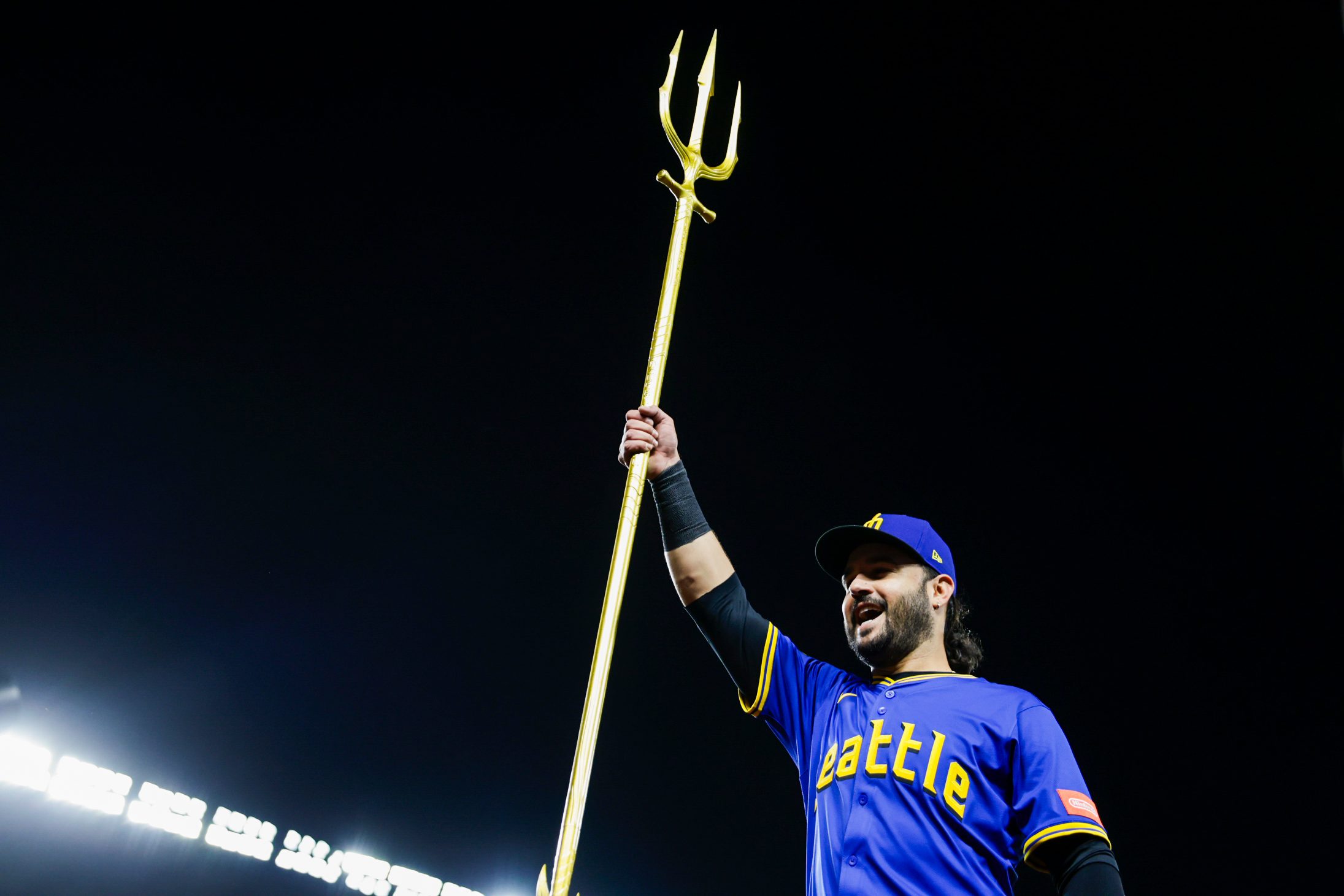 Sep 25, 2025; Seattle, Washington, USA; Seattle Mariners third baseman Eugenio Suarez (28) raises the trident to celebrate a victory against the Colorado Rockies at T-Mobile Park. Mandatory Credit: Joe Nicholson-Imagn Images