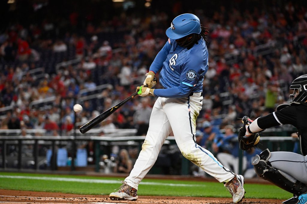 Sep 26, 2025; Washington, District of Columbia, USA; Washington Nationals first baseman Josh Bell (19) hits a solo home run against the Chicago White Sox during the first inning at Nationals Park. Mandatory Credit: Brad Mills-Imagn Images