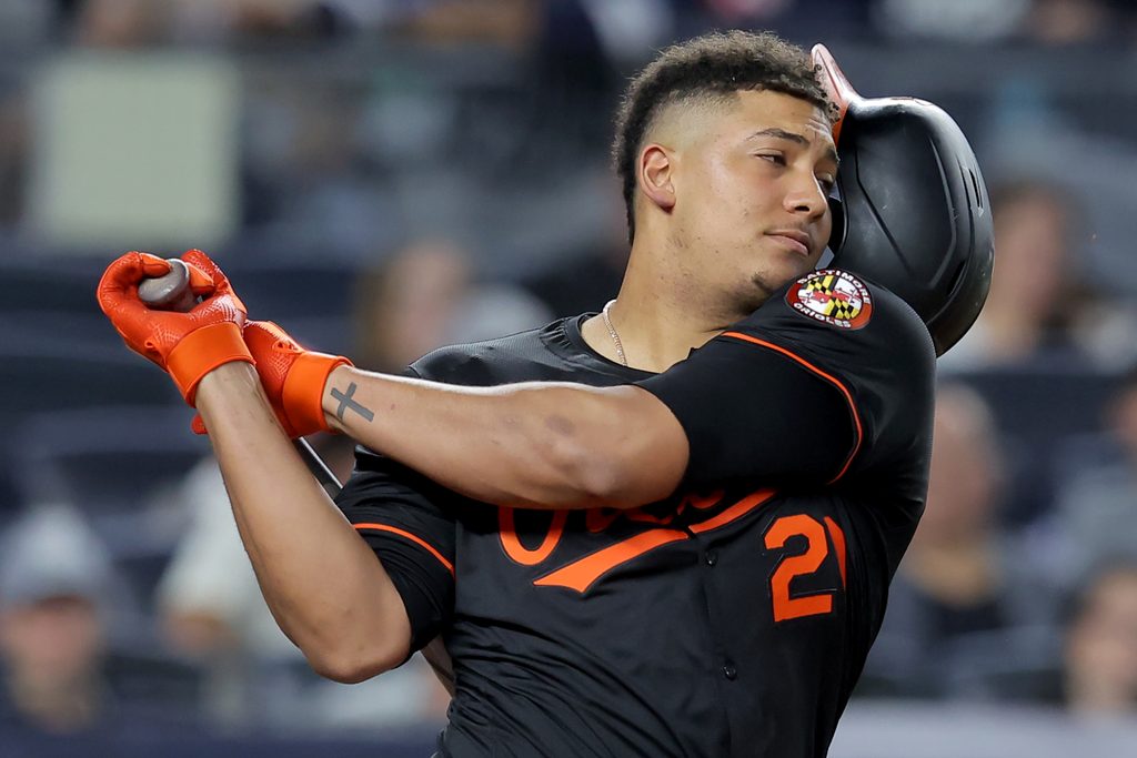 Sep 26, 2025; Bronx, New York, USA; Baltimore Orioles designated hitter Samuel Basallo (29) loses his helmet while swinging at a pitch during the sixth inning against the New York Yankees at Yankee Stadium. Mandatory Credit: Brad Penner-Imagn Images