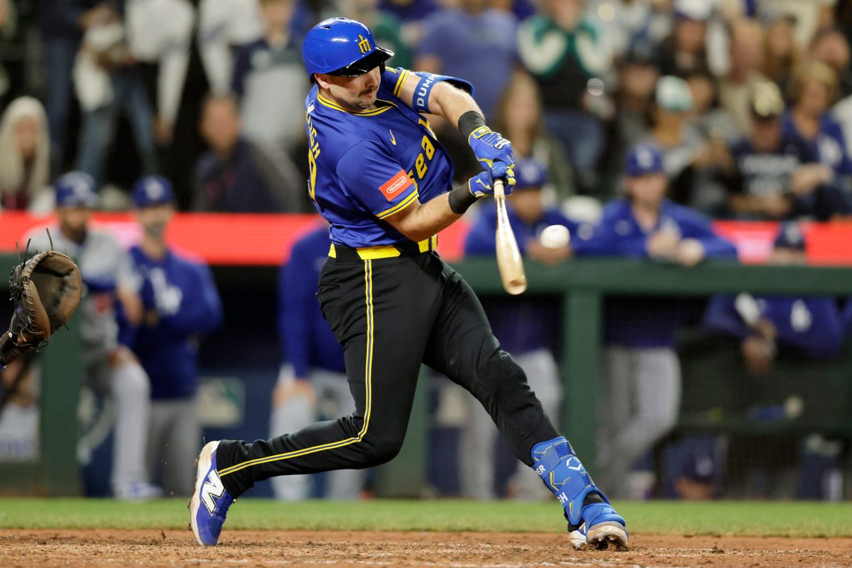 Sep 26, 2025; Seattle, Washington, USA; Seattle Mariners catcher Cal Raleigh (29) hits a double against the Los Angeles Dodgers during the ninth inning at T-Mobile Park. Mandatory Credit: John Froschauer-Imagn Images
