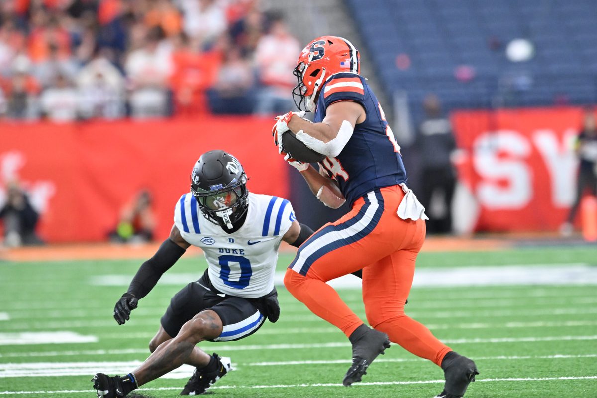 Sep 27, 2025; Syracuse, New York, USA; Duke Blue Devils cornerback Chandler Rivers (0) tries to tackle Syracuse Orange running back Will Nixon (24) in the second quarter at the JMA Wireless Dome. Mandatory Credit: Mark Konezny-Imagn Images