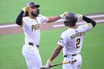 Sep 27, 2025; San Diego, California, USA; San Diego Padres right fielder Fernando Tatis Jr. (23) is congratulated by Luis Arraez (4) after hitting a solo home run during the first inning against the Arizona Diamondbacks at Petco Park. Mandatory Credit: Denis Poroy-Imagn Images