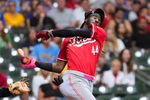 Sep 27, 2025; Milwaukee, Wisconsin, USA;  Cincinnati Reds shortstop Elly De La Cruz (44) loses his helmet while striking out during the ninth inning against the Milwaukee Brewers at American Family Field. Mandatory Credit: Jeff Hanisch-Imagn Images