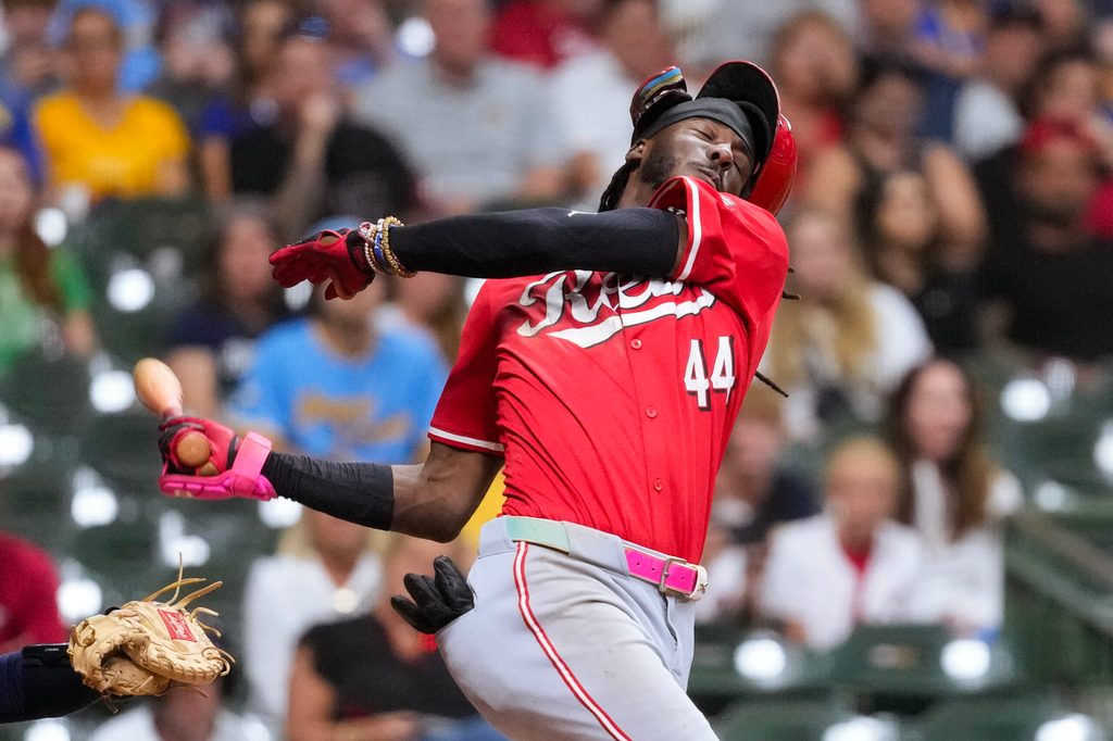 Sep 27, 2025; Milwaukee, Wisconsin, USA; Cincinnati Reds shortstop Elly De La Cruz (44) loses his helmet while striking out during the ninth inning against the Milwaukee Brewers at American Family Field. Mandatory Credit: Jeff Hanisch-Imagn Images