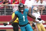 Sep 28, 2025; Santa Clara, California, USA; Jacksonville Jaguars running back Travis Etienne (1) reacts after scoring a touchdown against the San Francisco 49ers during the second quarter at Levi's Stadium. Mandatory Credit: Darren Yamashita-Imagn Images