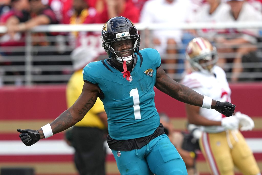 Sep 28, 2025; Santa Clara, California, USA; Jacksonville Jaguars running back Travis Etienne (1) reacts after scoring a touchdown against the San Francisco 49ers during the second quarter at Levi's Stadium. Mandatory Credit: Darren Yamashita-Imagn Images