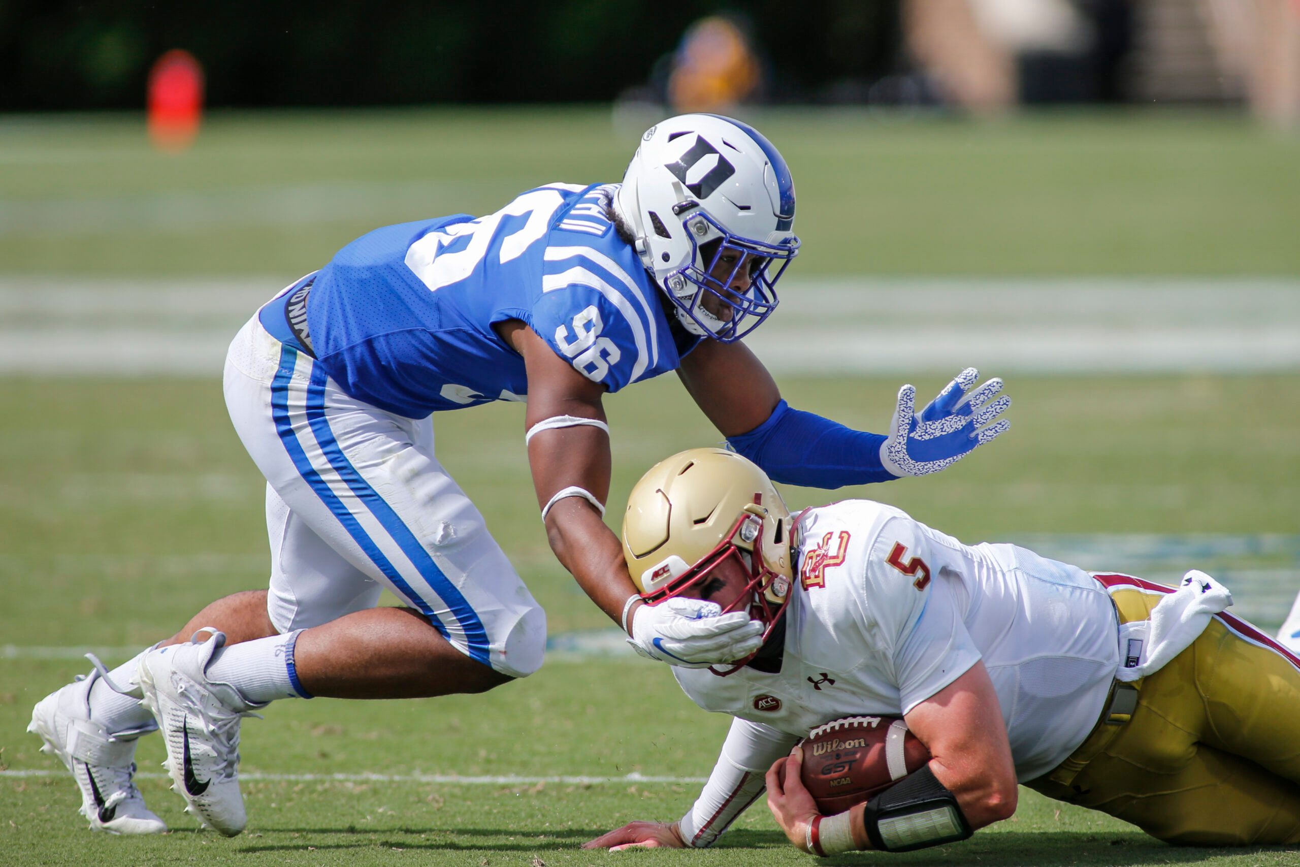 Sep 19, 2020; Durham, North Carolina, USA;  Duke Blue Devils linebacker Chris Rumph II (96) tackles Boston College Eagles quarterback Phil Jurkovec (5) at Wallace Wade Stadium. Mandatory Credit: Nell Redmond-Imagn Images