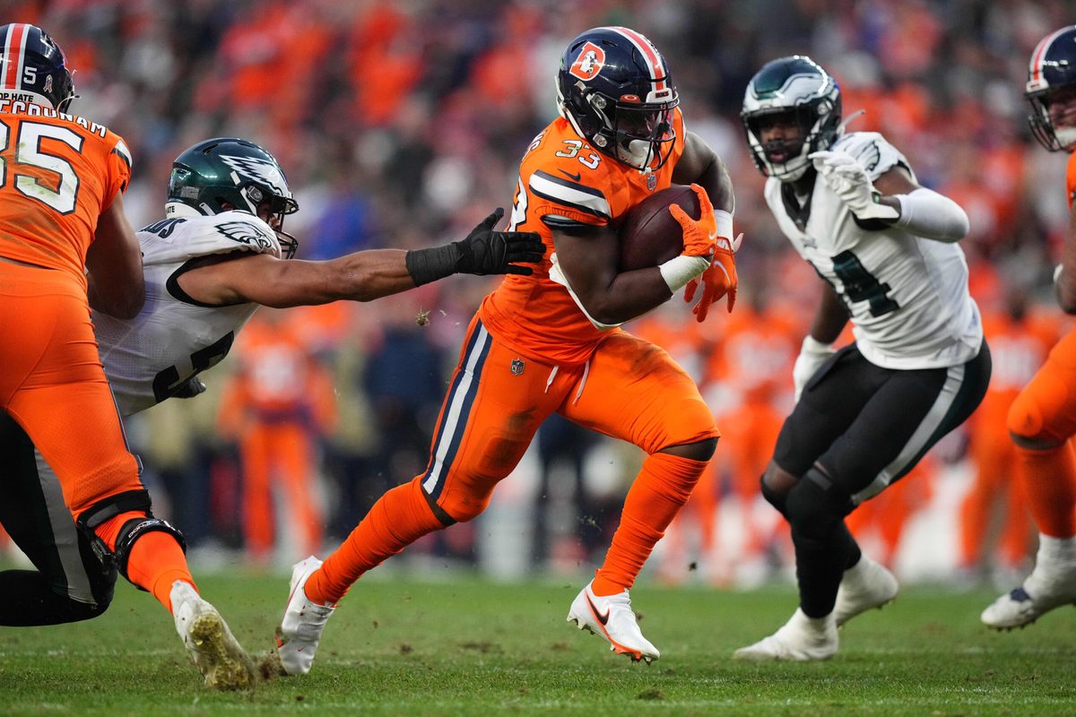 Nov 14, 2021; Denver, Colorado, USA; Denver Broncos running back Javonte Williams (33) carries the ball in the third quarter against the Philadelphia Eagles at Empower Field at Mile High. Mandatory Credit: Ron Chenoy-Imagn Images