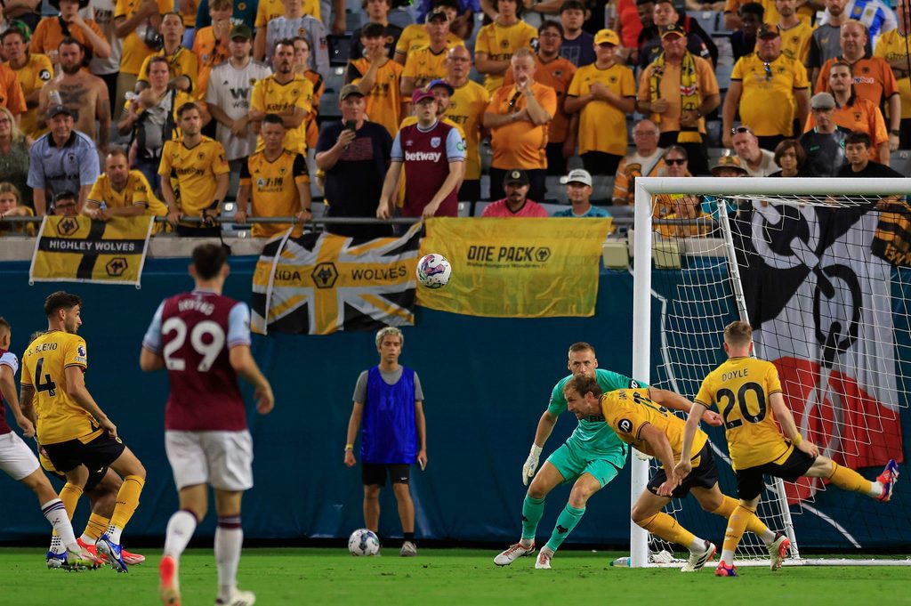 Wolverhampton Wanderers defender Craig Dawson (15) clears the net as goalkeeper Daniel Bentley (25) looks on during the second half of The Stateside Cup soccer tournament game Saturday, July 27, 2024 at EverBank Stadium in Jacksonville, Fla. The Wolverhampton Wanderers defeated West Ham United 3-1 in exhibition play.