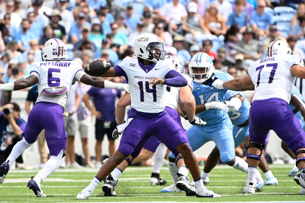 Sep 21, 2024; Chapel Hill, North Carolina, USA; James Madison Dukes quarterback Alonza Barnett III (14) looks to pass in the first quarter at Kenan Memorial Stadium. Mandatory Credit: Bob Donnan-Imagn Images