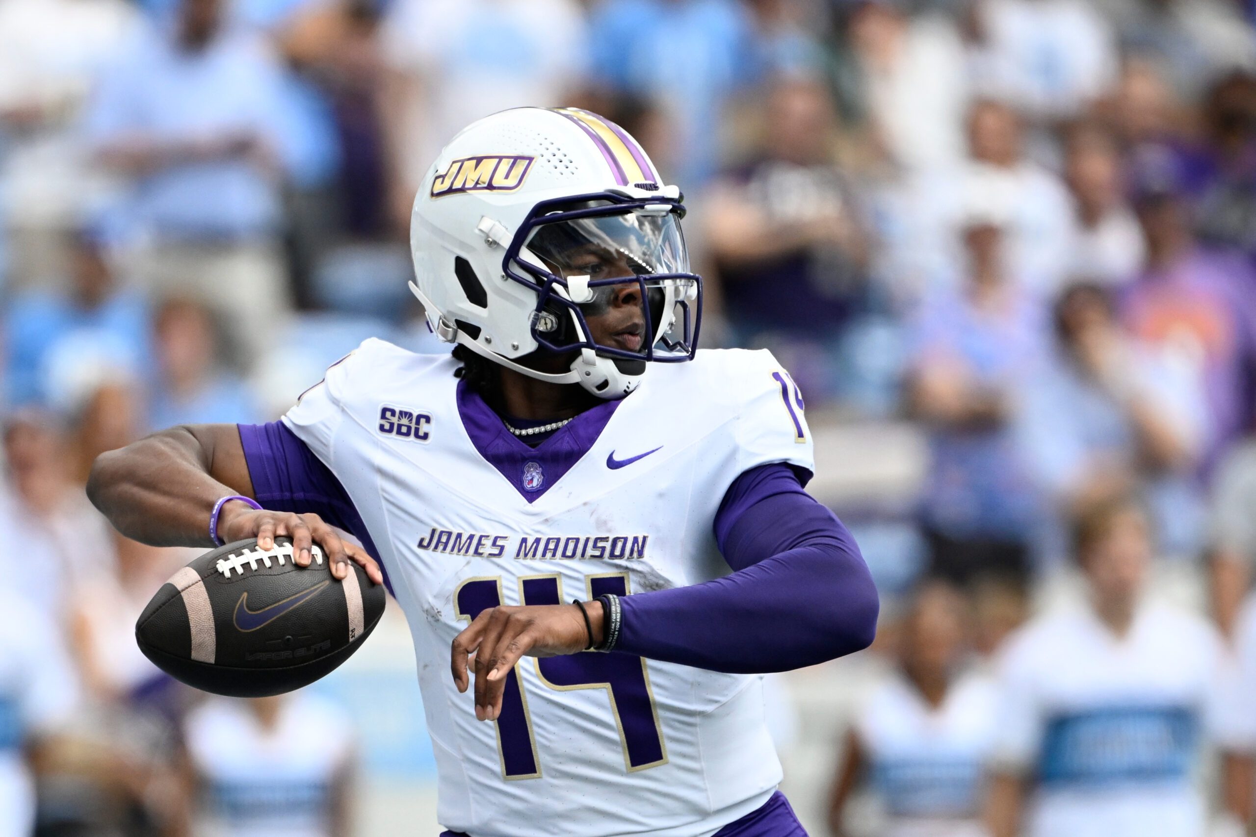 Sep 21, 2024; Chapel Hill, North Carolina, USA; James Madison Dukes quarterback Alonza Barnett III (14) looks to pass in the first quarter at Kenan Memorial Stadium. Mandatory Credit: Bob Donnan-Imagn Images