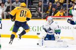 Jan 29, 2025; Nashville, Tennessee, USA;  Vancouver Canucks goaltender Thatcher Demko (35) blocks the shot of Nashville Predators center Jonathan Marchessault (81) during the third period at Bridgestone Arena. Mandatory Credit: Steve Roberts-Imagn Images