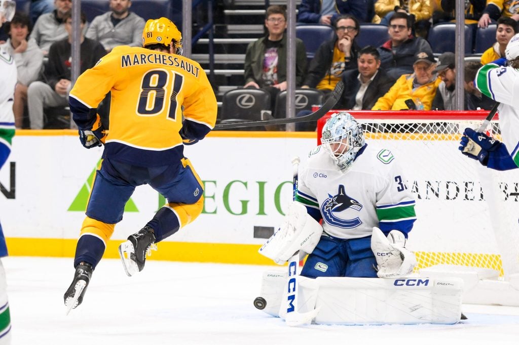 Jan 29, 2025; Nashville, Tennessee, USA; Vancouver Canucks goaltender Thatcher Demko (35) blocks the shot of Nashville Predators center Jonathan Marchessault (81) during the third period at Bridgestone Arena. Mandatory Credit: Steve Roberts-Imagn Images