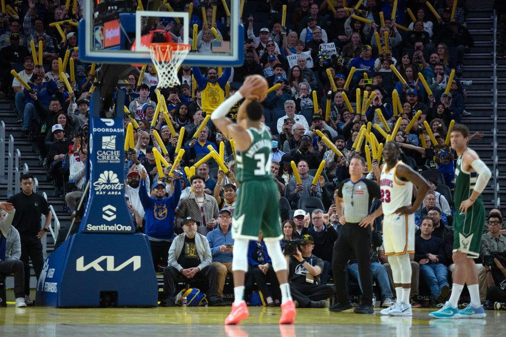 Mar 18, 2025; San Francisco, California, USA; Golden State Warriors fans attempt to distract Milwaukee Bucks forward Giannis Antetokounmpo (34) as he shoots a free throw during the fourth quarter at Chase Center. Mandatory Credit: D. Ross Cameron-Imagn Images