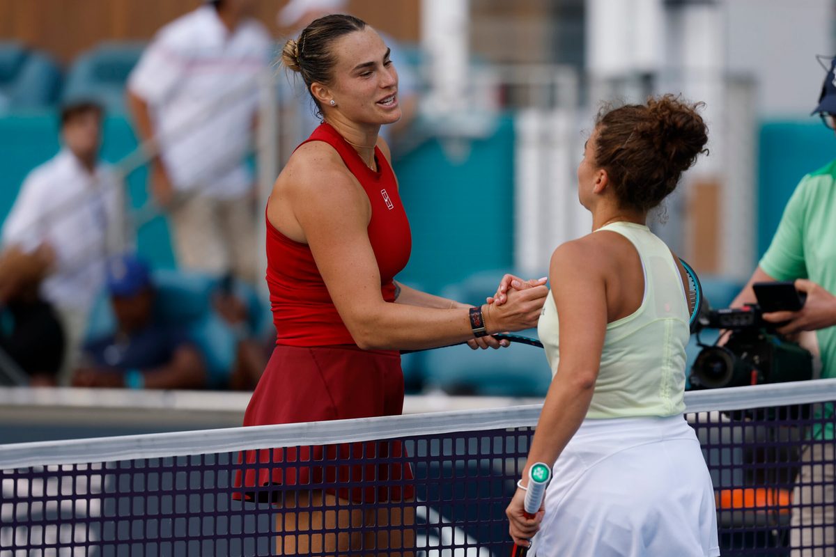 Mar 27, 2025; Miami, FL, USA; Aryna Sabalenka (L) shakes hands with Jasmine Paolini (ITA)(R) at the net after their women's singles semifinal on day ten of the Miami Open at Hard Rock Stadium. Mandatory Credit: Geoff Burke-Imagn Images