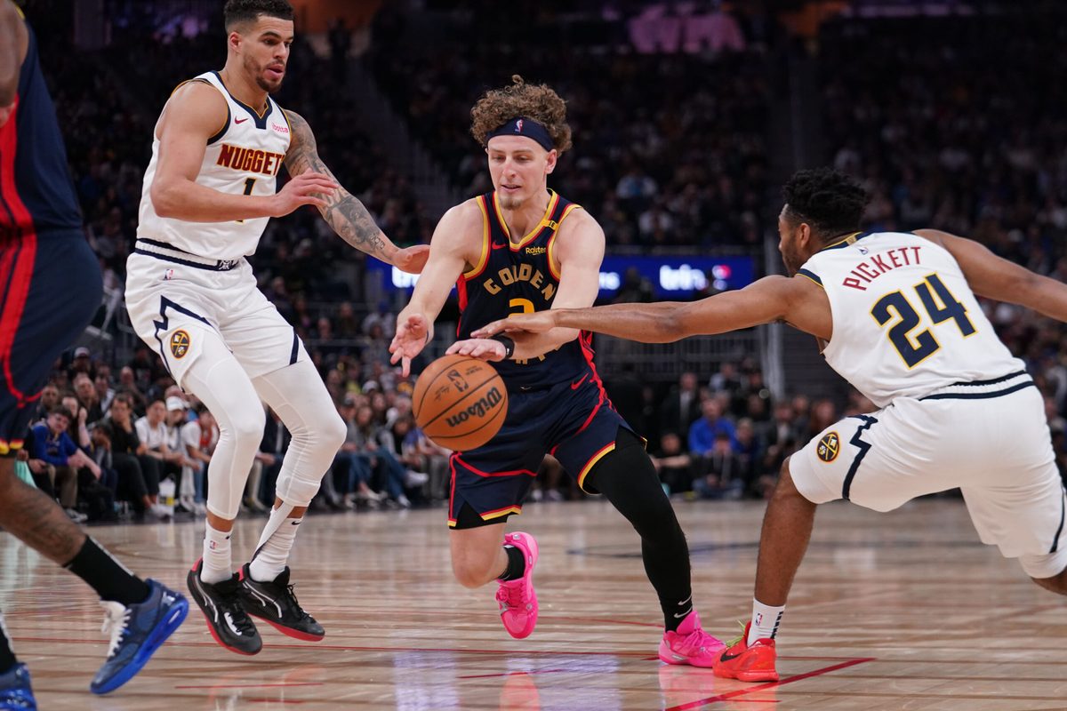 Apr 4, 2025; San Francisco, California, USA; Golden State Warriors guard Brandin Podziemski (2) dribbles by Denver Nuggets forward Michael Porter Jr. (1) and Denver Nuggets guard Jalen Pickett (24) in the third period at Chase Center. Mandatory Credit: David Gonzales-Imagn Images