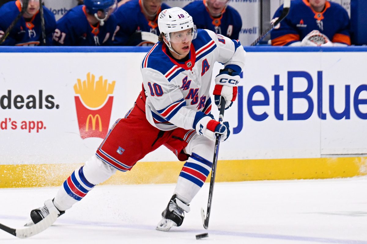 Apr 10, 2025; Elmont, New York, USA; New York Rangers left wing Artemi Panarin (10) skates across the blue against the New York Islanders during the first period at UBS Arena. Mandatory Credit: Dennis Schneidler-Imagn Images