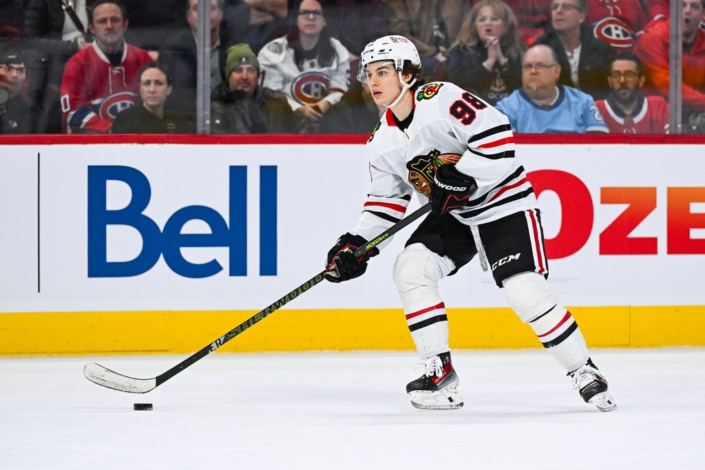 Apr 14, 2025; Montreal, Quebec, CAN; Chicago Blackhawks center Connor Bedard (98) plays the puck against the Montreal Canadiens in the first period at Bell Centre. Mandatory Credit: David Kirouac-Imagn Images