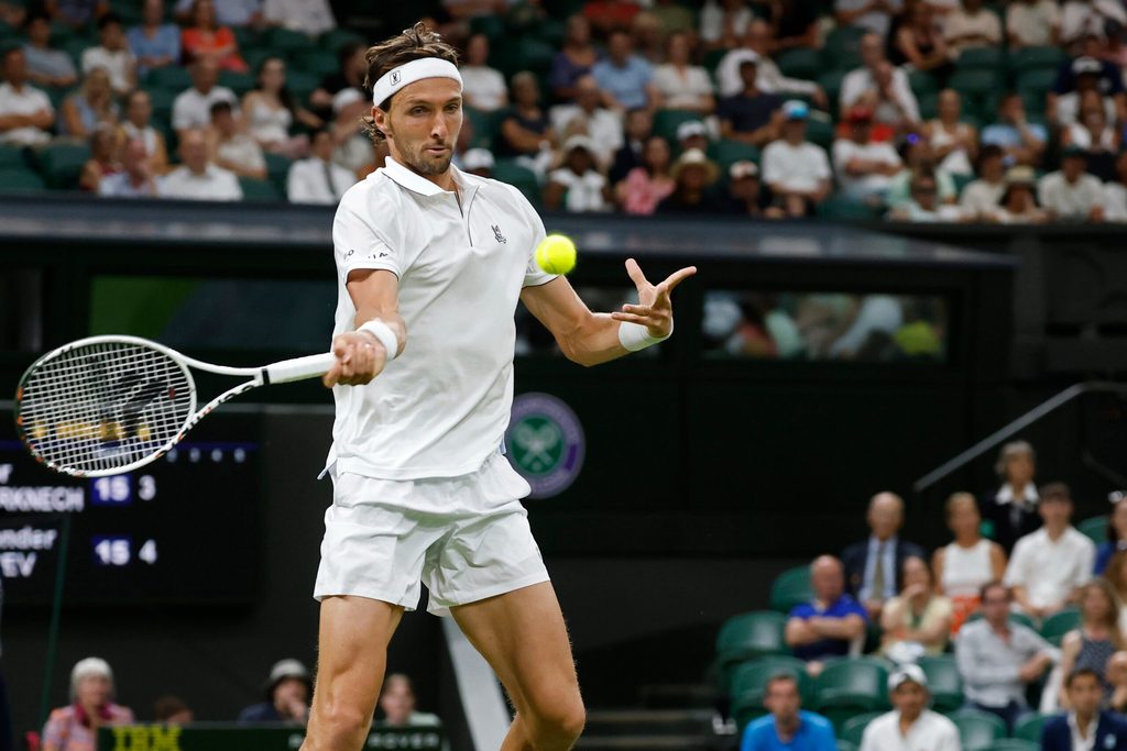 Jun 30, 2025; Wimbledon, United Kingdom; Arthur Rinderknech (FRA) hits a forehand against Alexander Zverev (GER)(not pictured) on day one of The Championships, Wimbledon 2025 at All England Lawn Tennis and Croquet Club. Mandatory Credit: Geoff Burke-Imagn Images