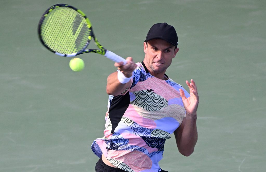 Aug 1, 2025; Toronto, ON, Canada; Aleksandar Vukic (AUS) plays a shot against Frances Tiafoe (USA) during third round play at Sobeys Stadium. Mandatory Credit: Dan Hamilton-Imagn Images
